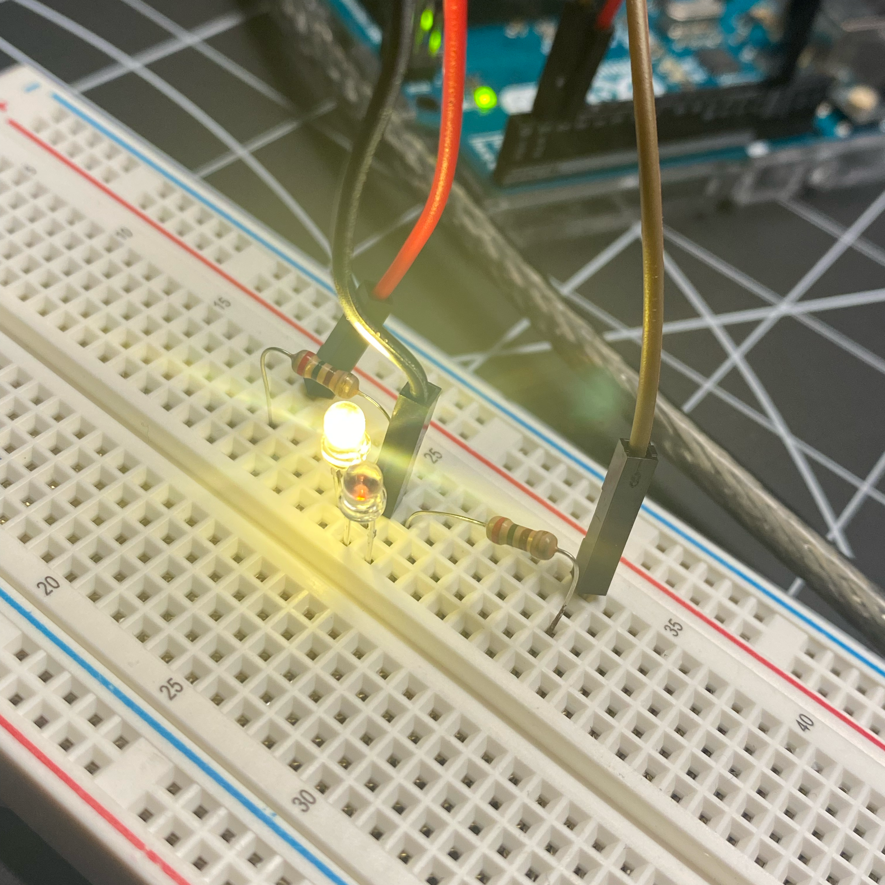 Expanding on the last circuit with two resistors and two lights. Observed that one of the lights is dimmer than the other.