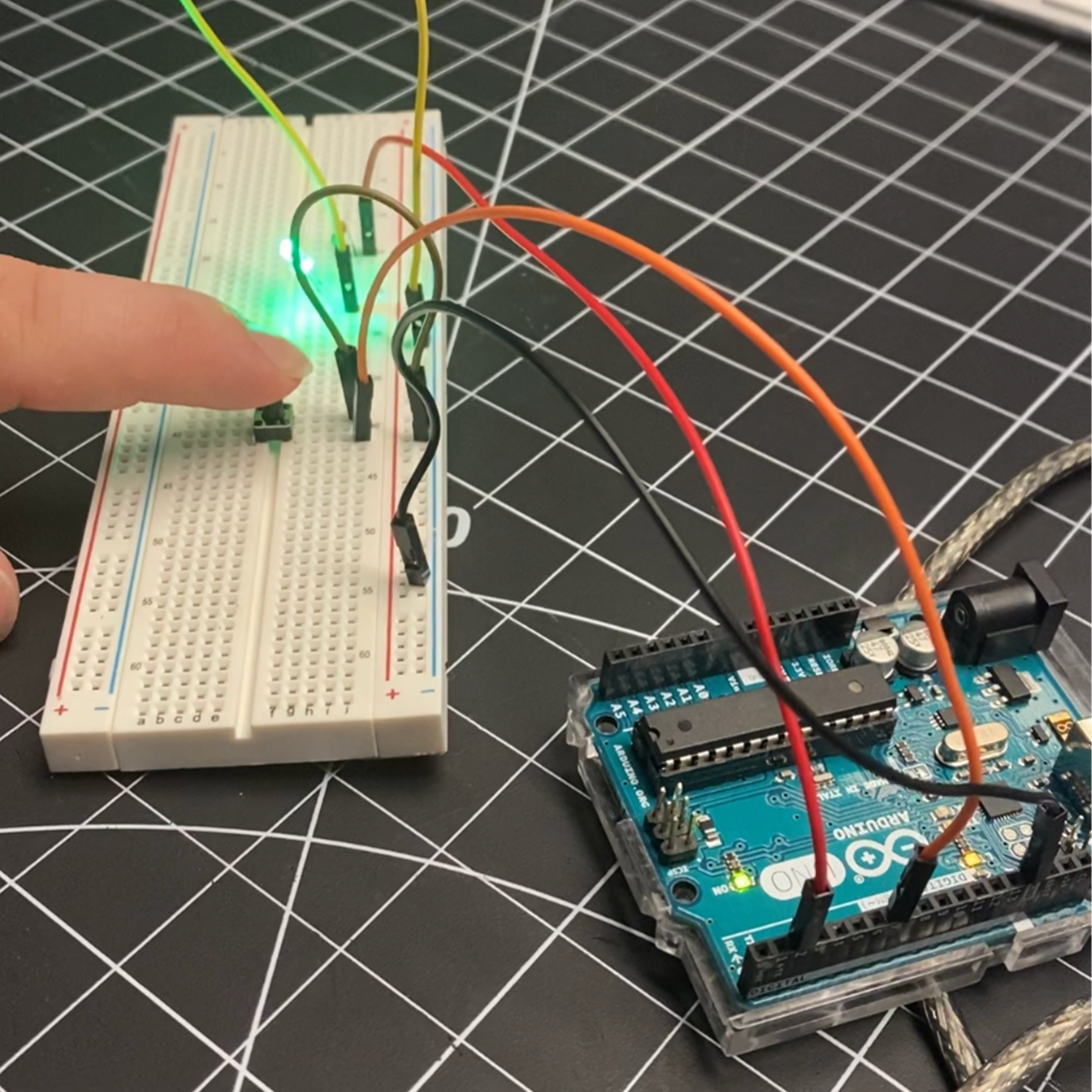 Experimenting with a button in relation to the light. When the button is pressed, the light turns on.