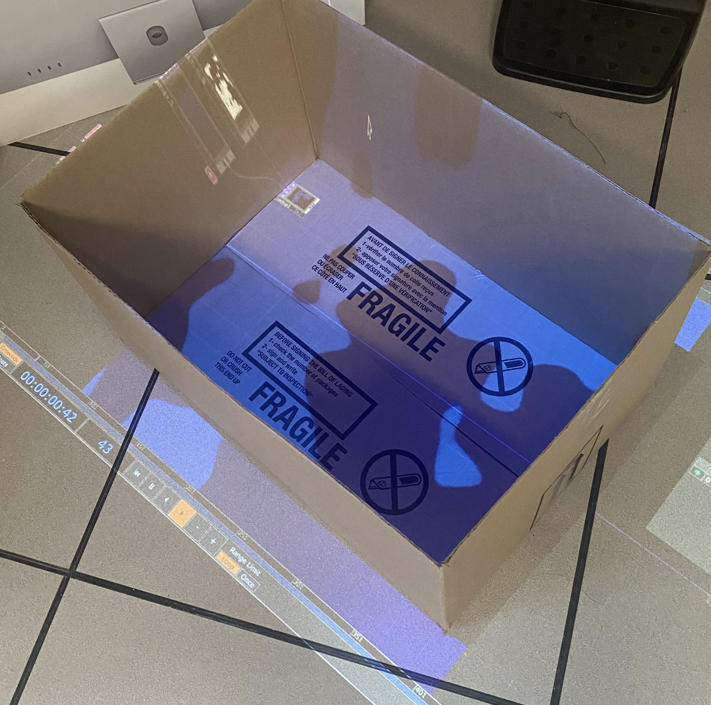 We placed the box down as the projector was facing downwards, but we actually ideally wanted the box to sit upright, as the bottom of the box in the photo is supposed to be a wall. 